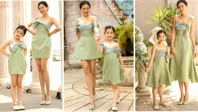 Mẹ âu yếm ôm con gái bé nhỏ trong vòng tay